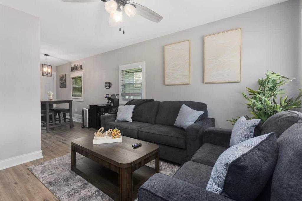a living room with a couch and a table at Olathe corporate retreat in Olathe