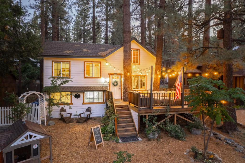 a tiny house in the woods with a deck at Aery Pines in Wrightwood