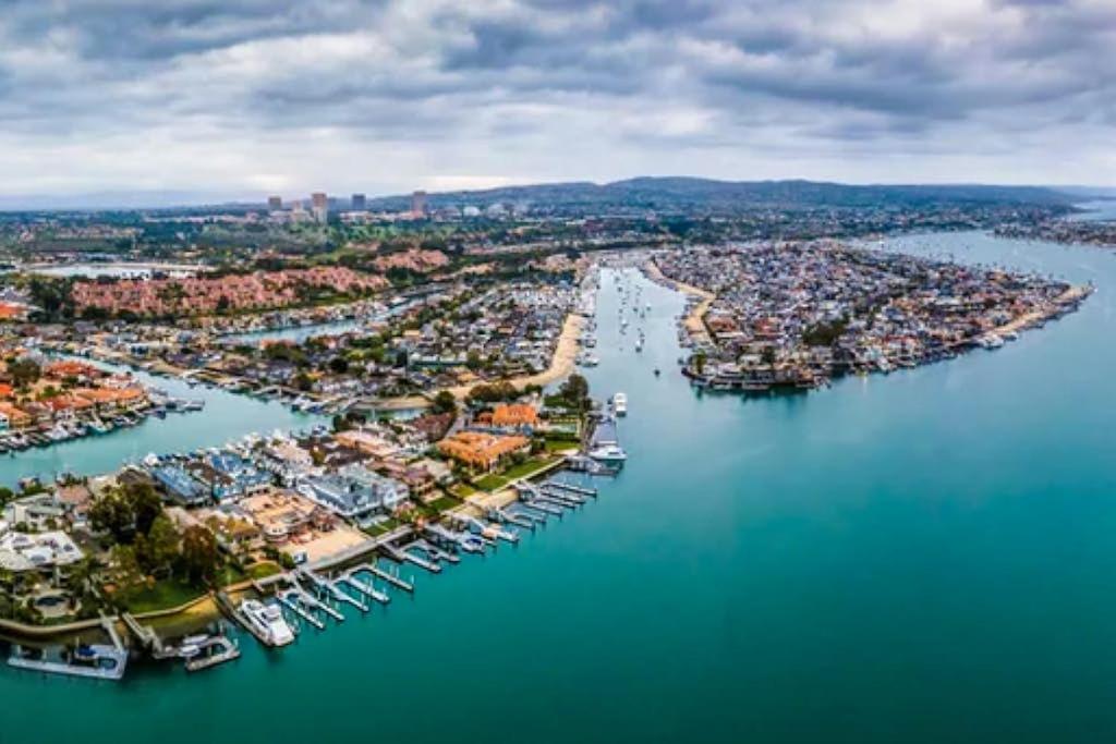 an aerial view of a harbor with boats in the water at Balboa Blue Lagoon in Newport Beach