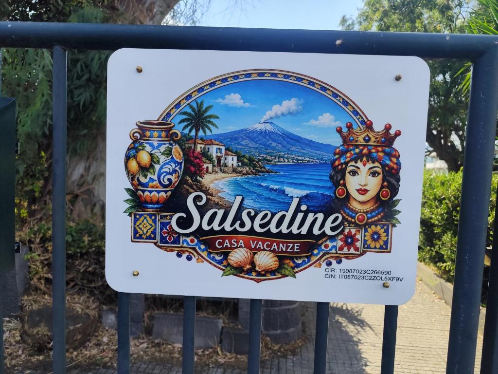a sign for a souvenir shop on a gate at Casa vacanze SALSEDINE in Mascali