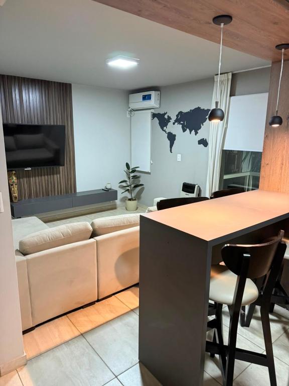 a living room with a couch and a table at Olivia apart in Chajarí