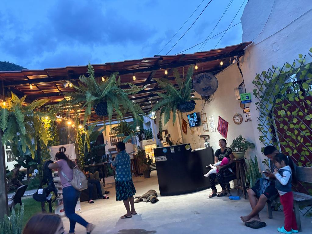 a group of people standing outside of a building at Gutierrez Hotel in Panajachel