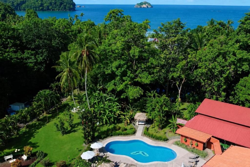 an aerial view of a resort with a swimming pool at Hotel Espadilla Gardens in Quepos