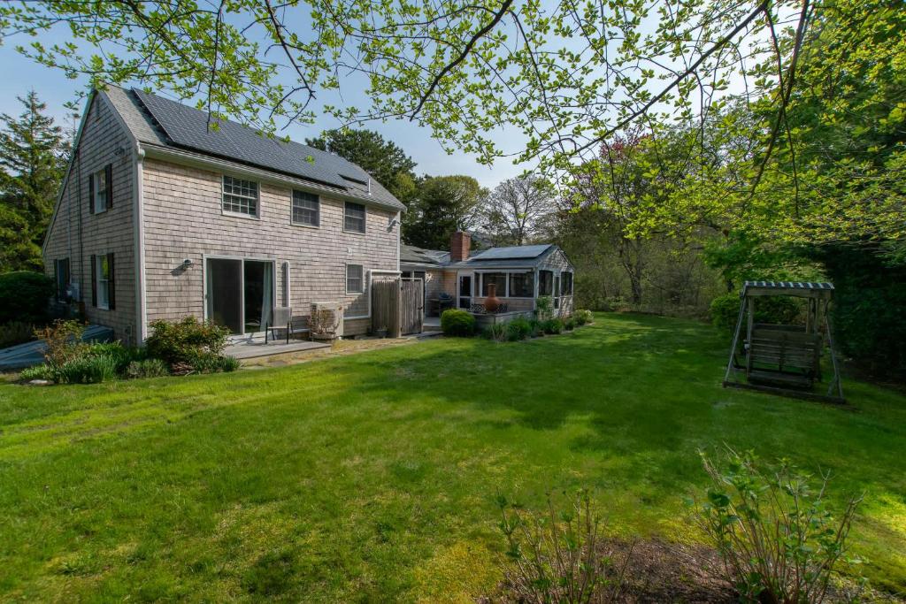 a yard with a house and a gazebo at Spacious Mins from Beach & Dogs Welcome in Eastham