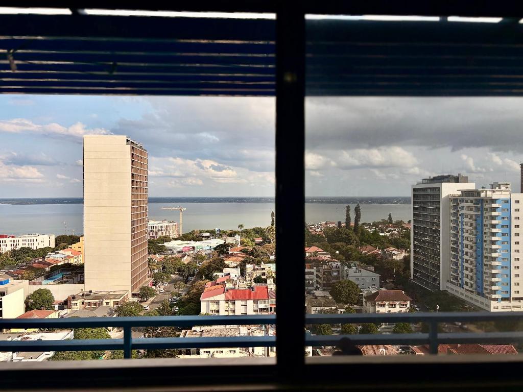 a view of a city from a window at Polana View Apartment I in Maputo