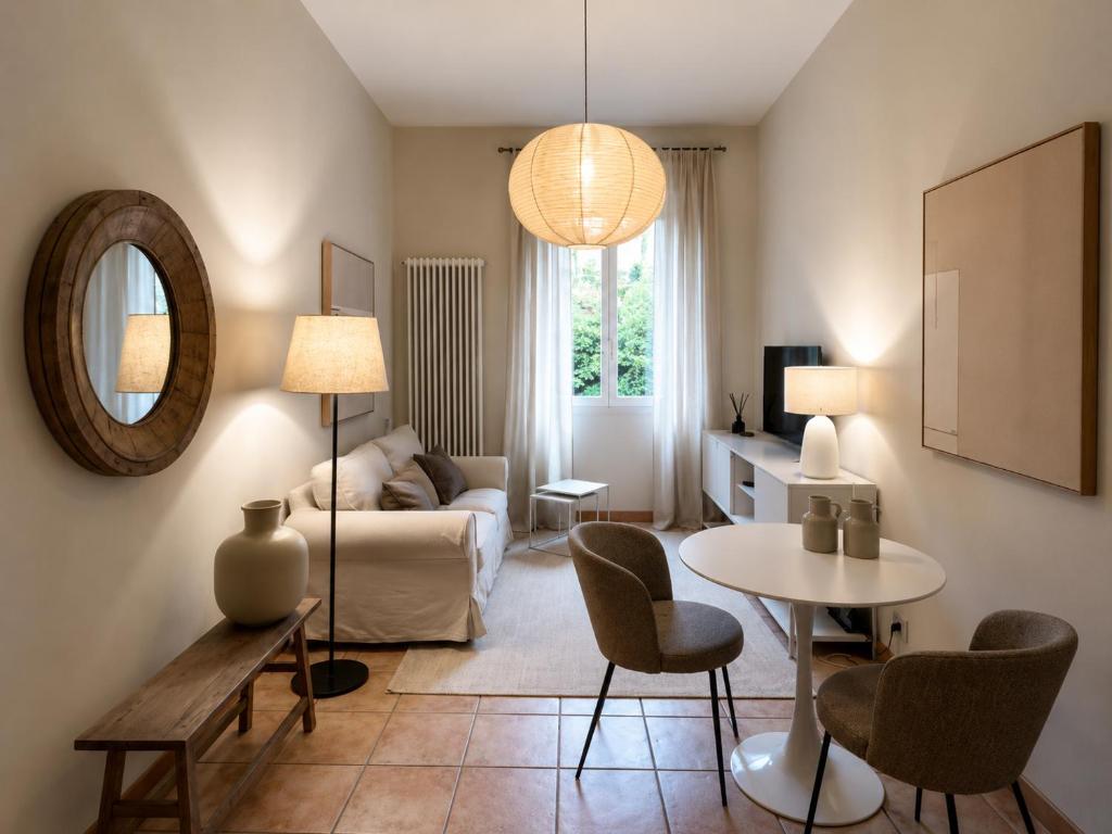 a living room with a couch and a table at Casa Vacanza Saint George - Hotel San Giuseppe Group in Cernobbio