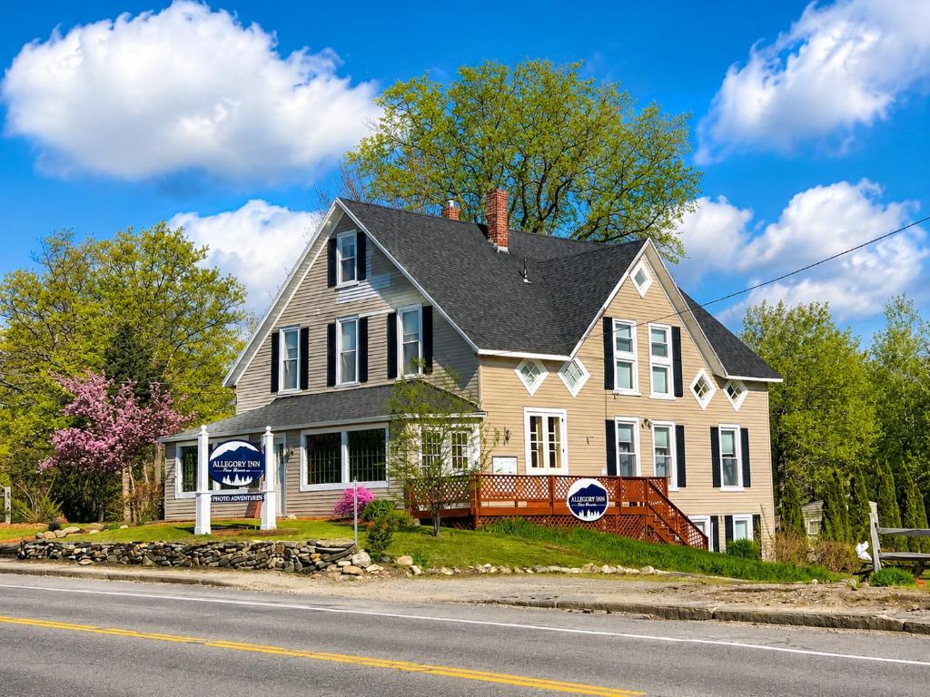 a large house on the side of the road at Allegory Inn in Twin Mountain