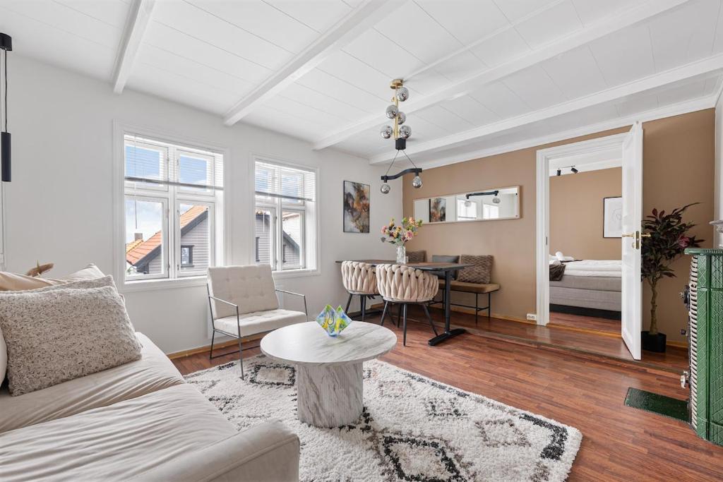 a living room with a couch and a table at The Brown Door in Stavanger