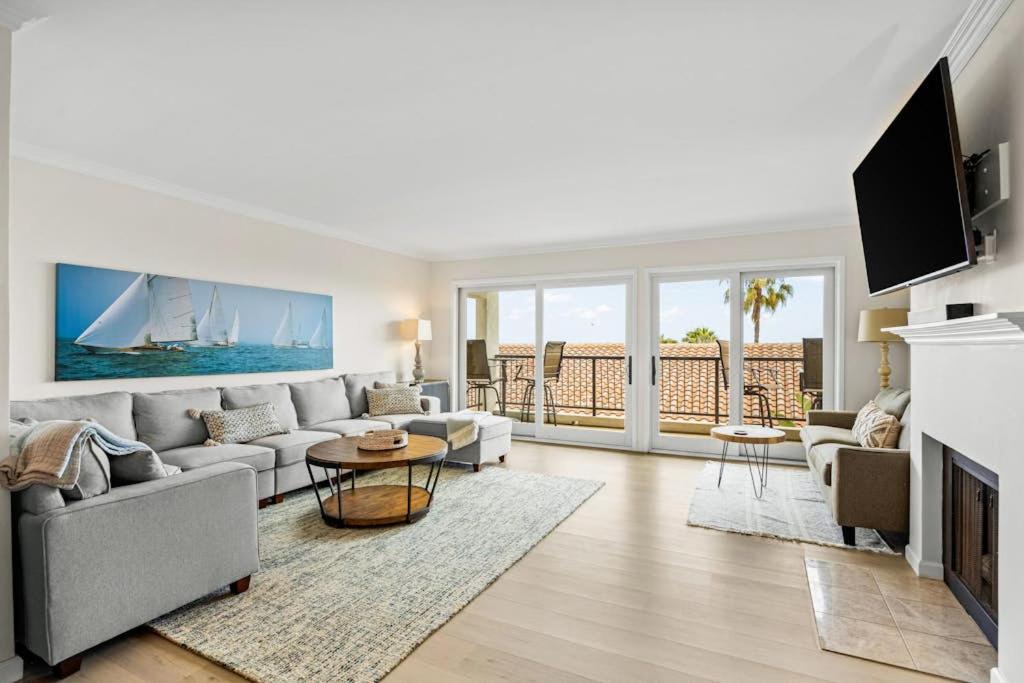 a living room with a couch and a table at Beach Retreat in Santa Barbara