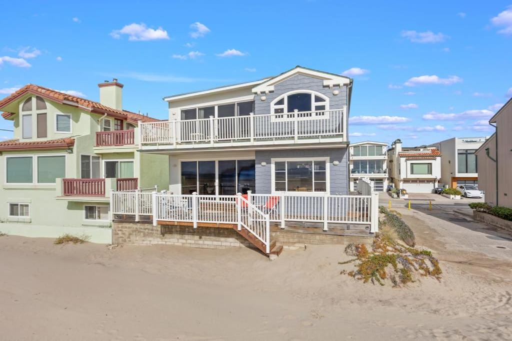 a large house with a balcony on the beach at Sand Side Bliss in Oxnard