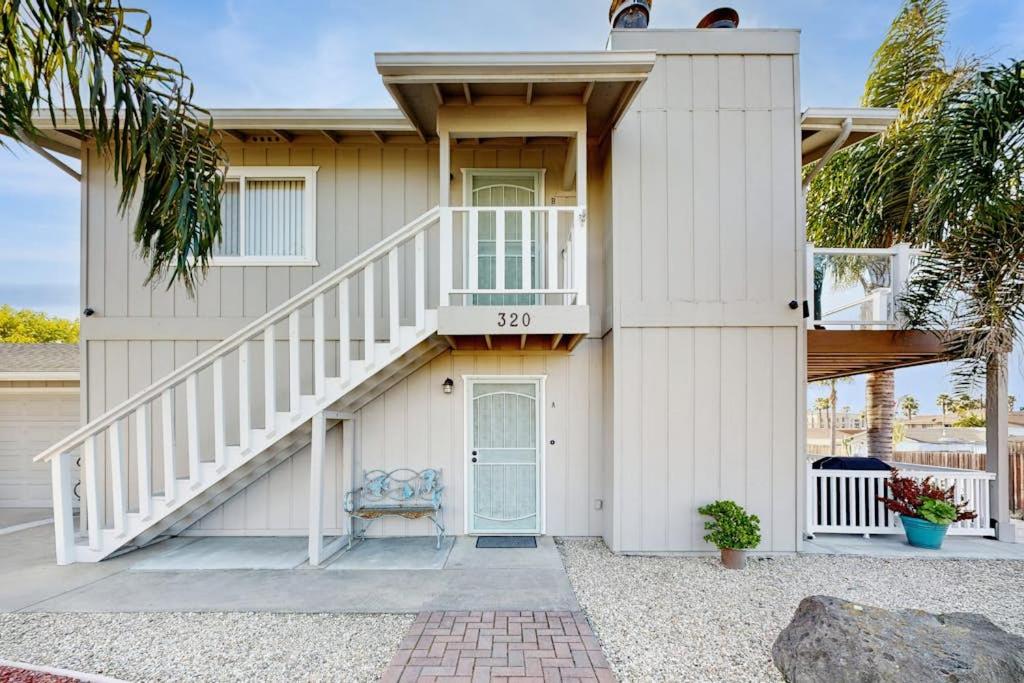a house with a staircase in front of it at Ramona Memories in Grover Beach