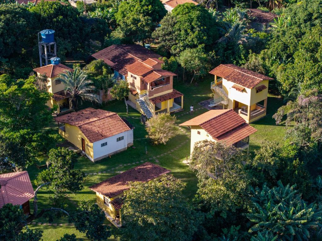 an aerial view of a house with trees at Pousada Casa da Trilha in Vale do Capao