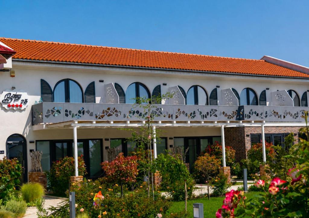 a building with writing on the side of it at Boutique 23 in Douăzeci şi Trei August