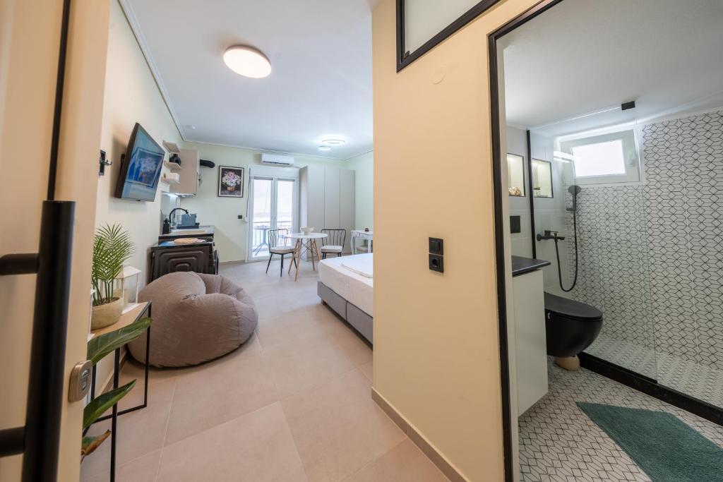 a hotel room with a bed and a bathroom at Modern Studios for Two in Mytilene