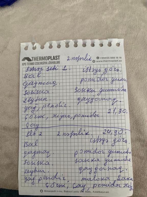 a sheet of paper with handwriting on it at Hotel Cenub in Astara