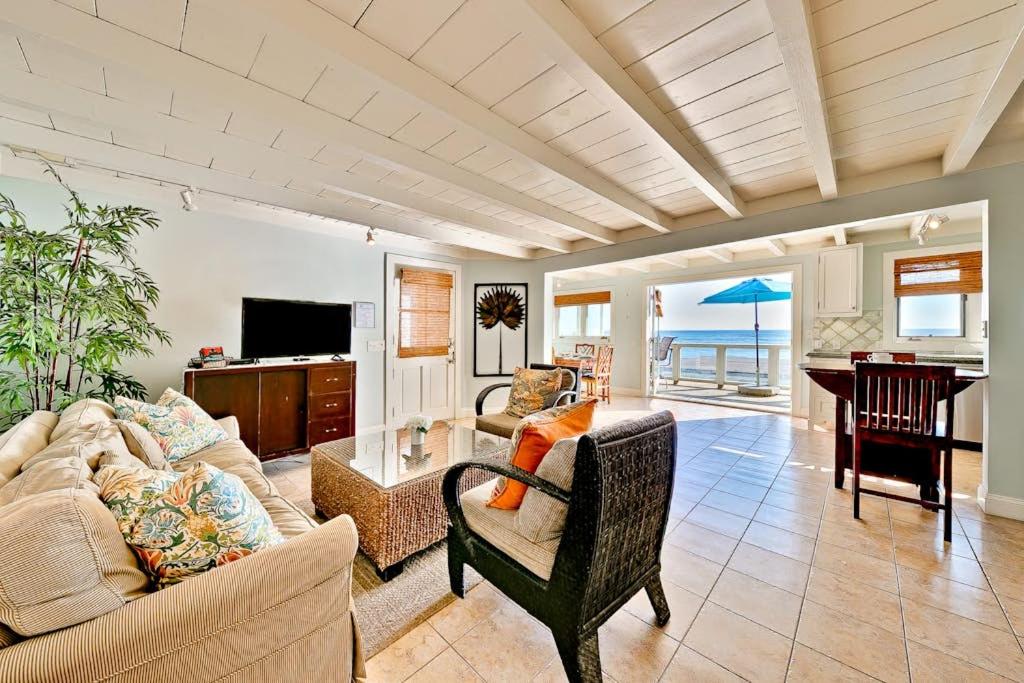 a living room with a couch and a table at Tommy Bahama Beach Rd II in Dana Point