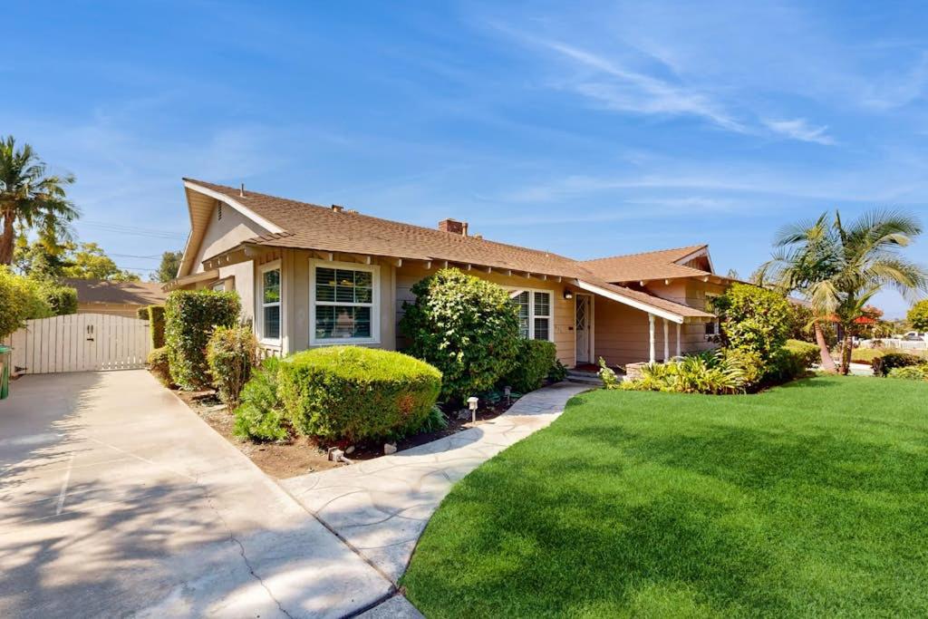 a house with a green lawn in front of it at Evening Oasis in Orange