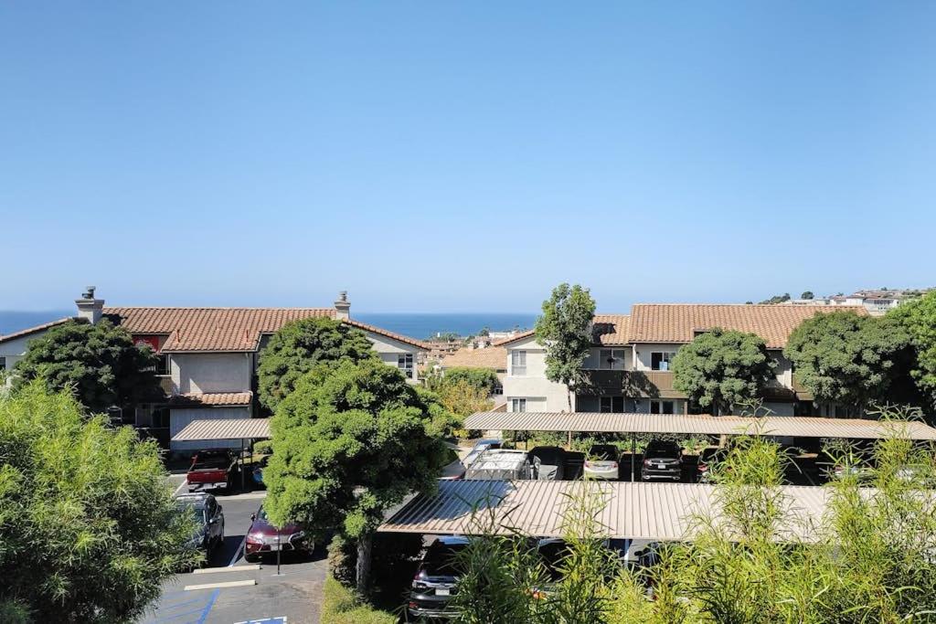 an overhead view of a city with trees and buildings at Monarch Vista in Dana Point