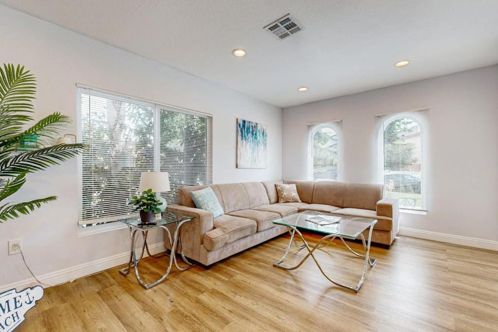 a living room with a couch and a table at Sunshine Fun Time in Newport Beach