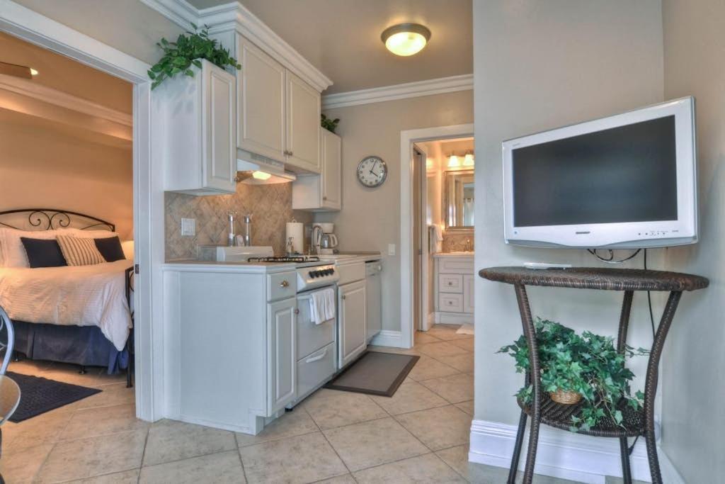 a kitchen with a flat screen tv on a wall at San Clemente - Monterey D in San Clemente