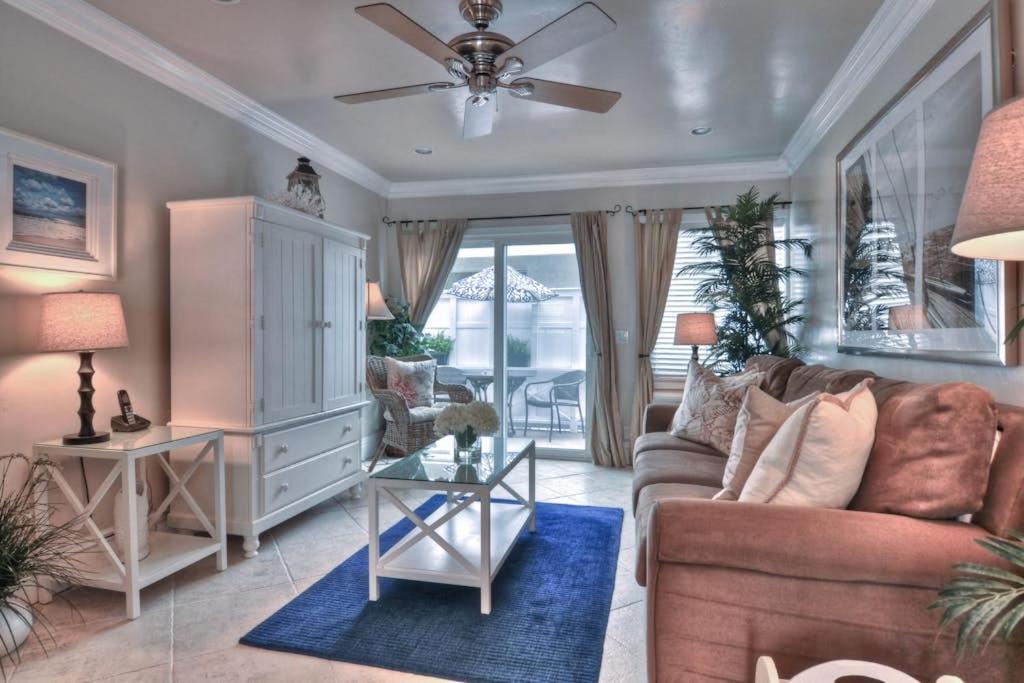 a living room with a couch and a ceiling fan at San Clemente - Monterey B in San Clemente