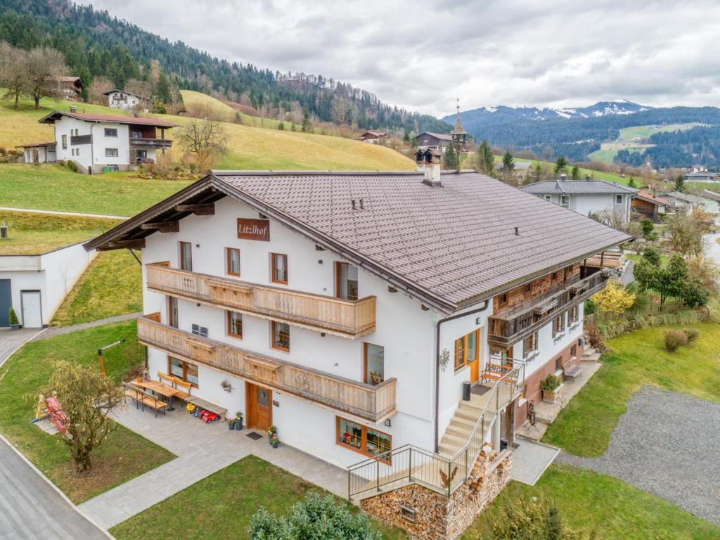 an aerial view of a large white house at Litzlhof Kraftplatzl in Itter