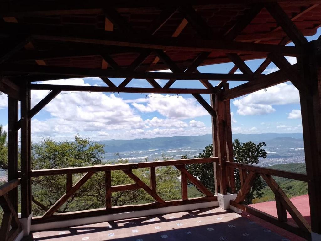 a view from the inside of a wooden building at Off-grid mountain house with a view La Manchoza in Tapalpa