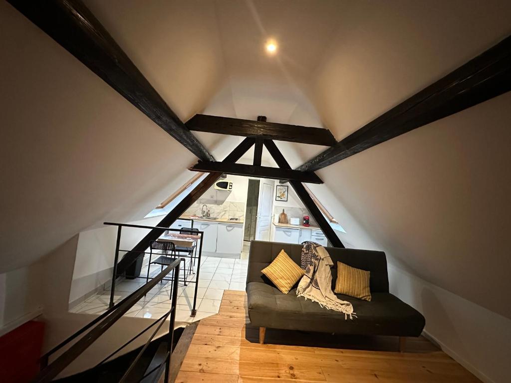 a living room with a couch in a attic at Alsacian home in Eckbolsheim
