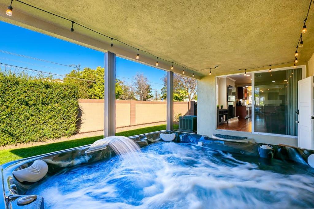 a hot tub in the backyard of a house at Dream Getaway in Anaheim