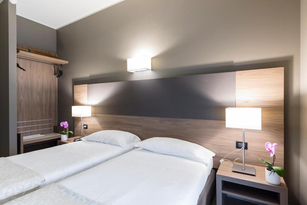 Postel nebo postele na pokoji v ubytování Hotel Sunflower