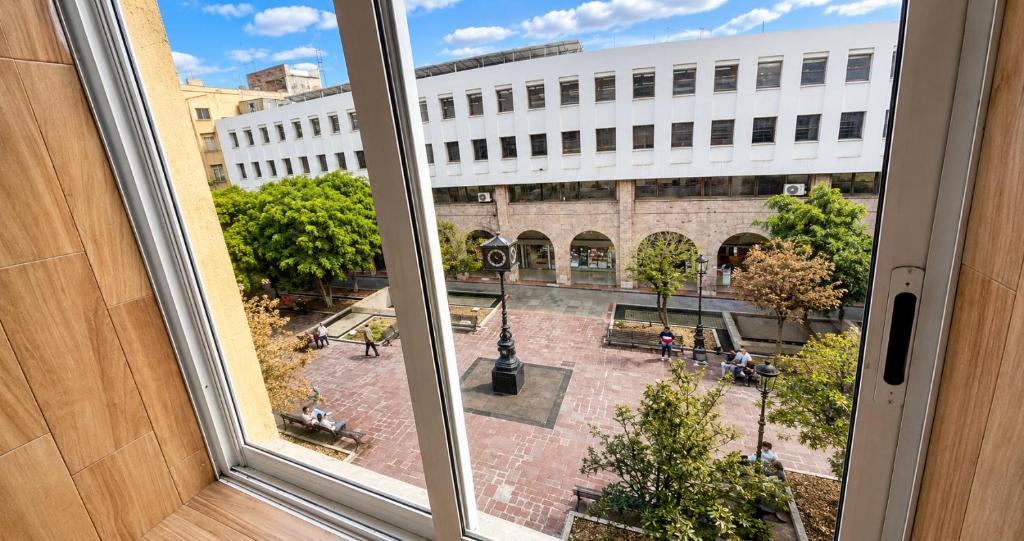 an open window with a view of a courtyard at Hotel Plaza Tapatia in Guadalajara