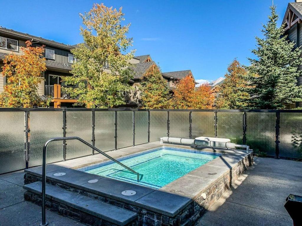 a hot tub in the backyard of a house at Rocky Mountain Condo with views of Grotto Mtn and hot tub in Dead Man's Flats
