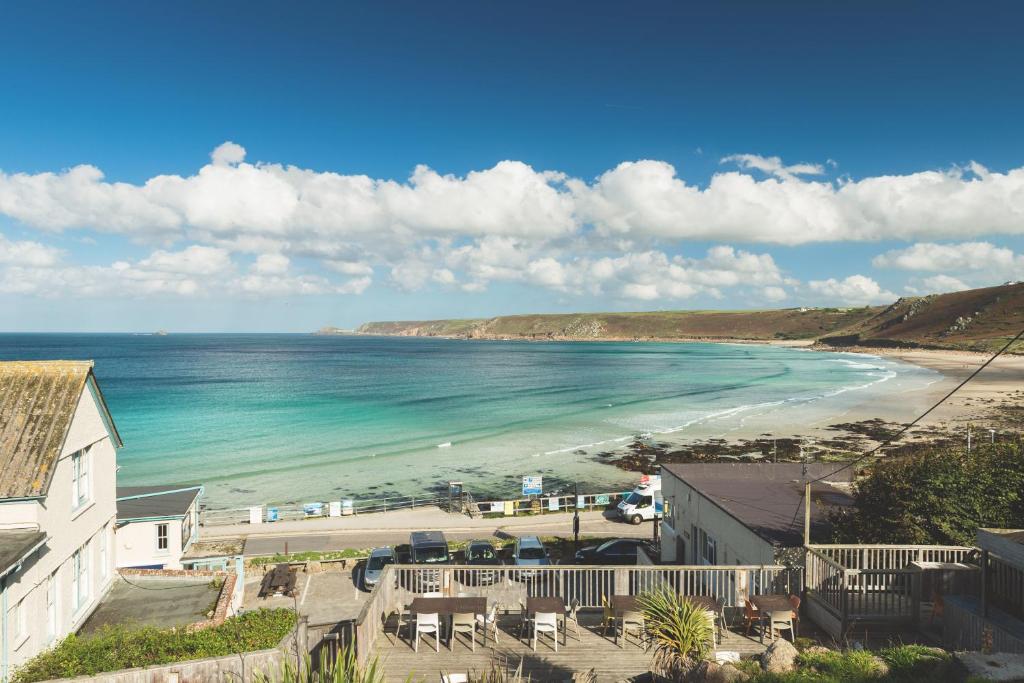 a view of a beach and the ocean at The Old Success Inn in Sennen Cove