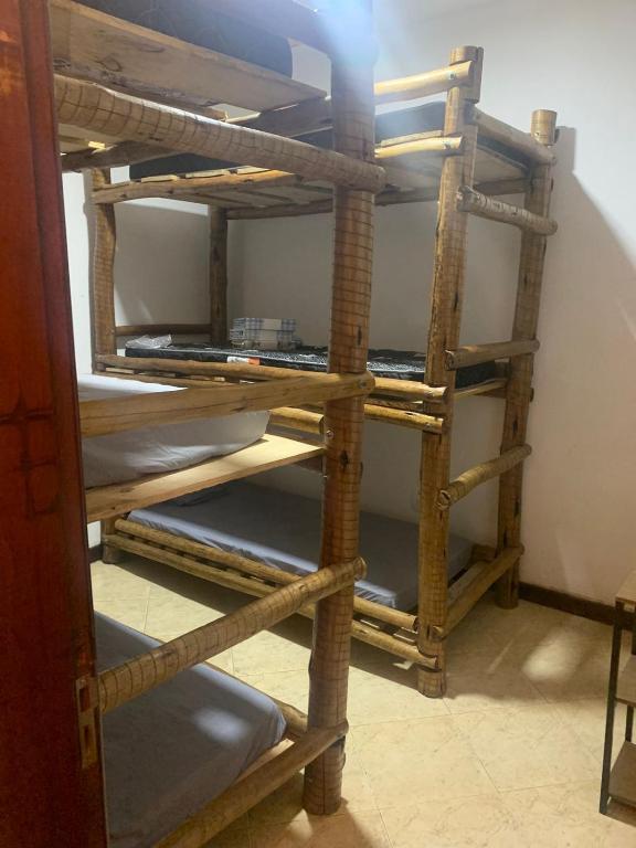 a stack of wooden shelves in a room at Hostel e Camping Terapia Roots in Santa Teresinha