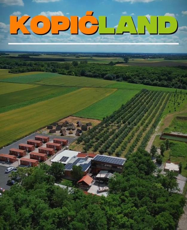 an aerial view of a school campus with the words kopedia land at Kopićland TENT in Marinci