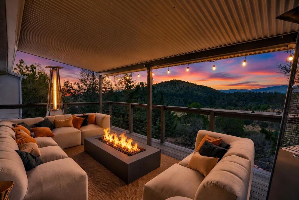 a living room with a couch and a fire pit at Prescott Mountain Luxury Escape! in Prescott
