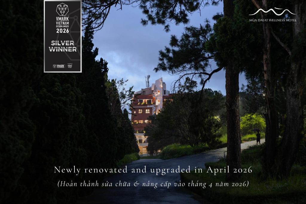 a poster of a building in a park at Mùa Dalat Wellness Hotel in Da Lat