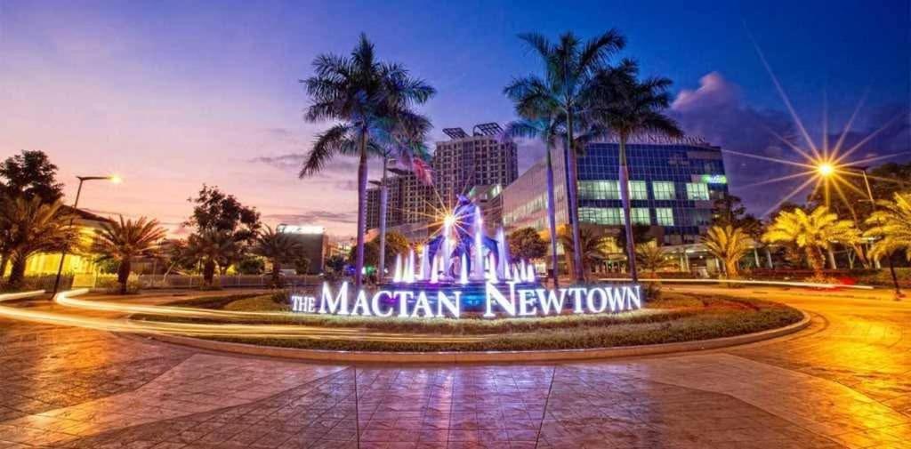 a sign that reads the miami new town at night at Classy 1Bedroom with Balcony in Punta Engaño