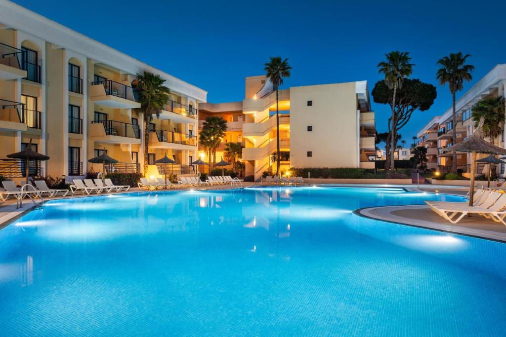 a large swimming pool in front of a building at SOL by Meliá Sancti Petri in Chiclana de la Frontera