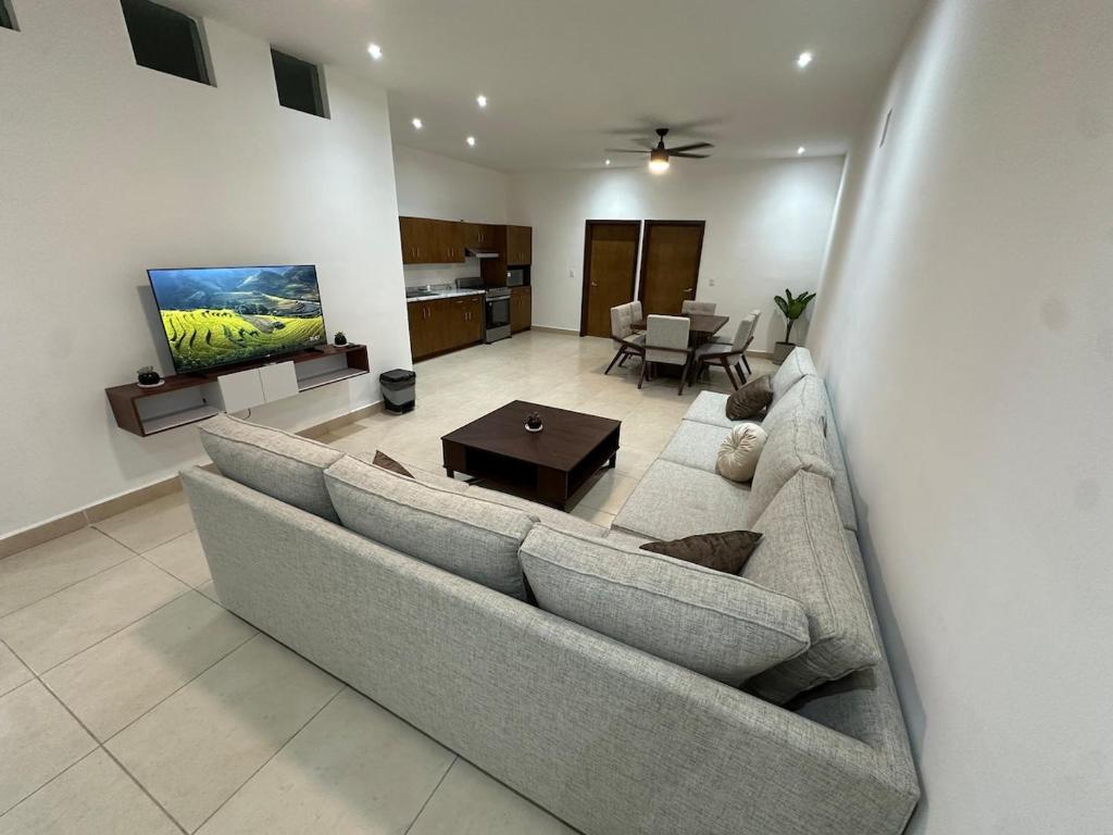 a living room with a couch and a table at Cumbres Living in Saltillo