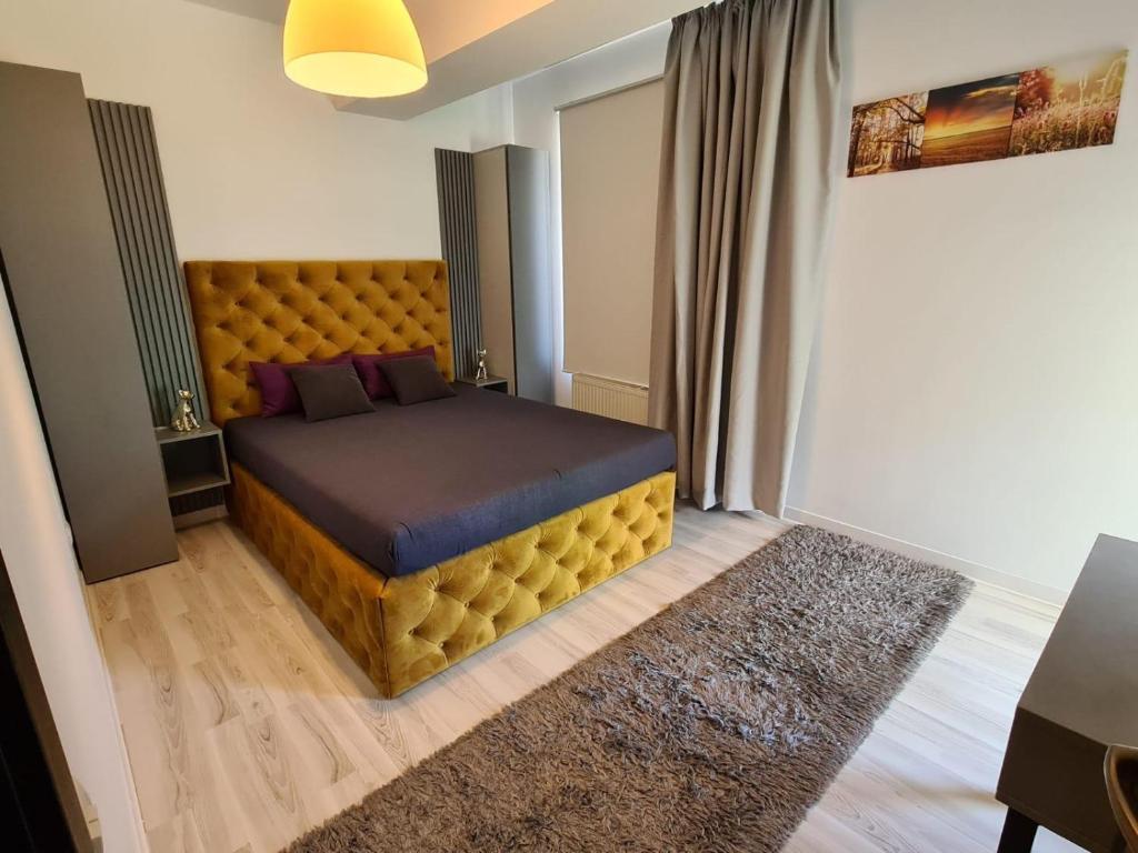 a bedroom with a large bed in a room at Bran' s in Constanţa