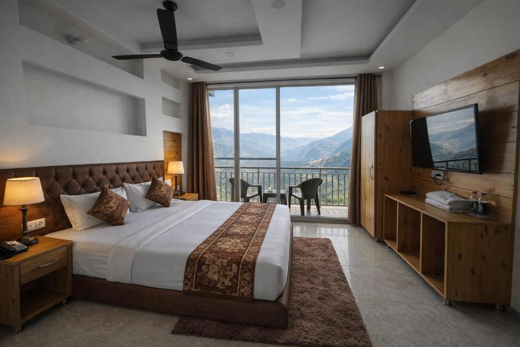 a bedroom with a bed and a large window at Hotel The Nature Heaven, Mussoorie - Affordable Luxury Stay in Mussoorie with Mountain View in Mussoorie