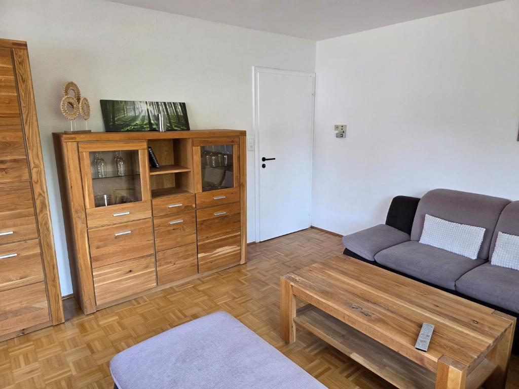 a living room with a couch and a coffee table at Seehaus Brigitte in Owingen
