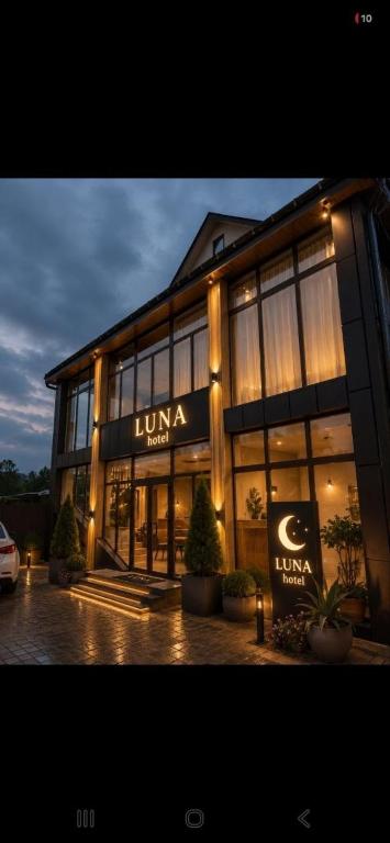 a large building with a sign on the front of it at Luna in Solotvyno
