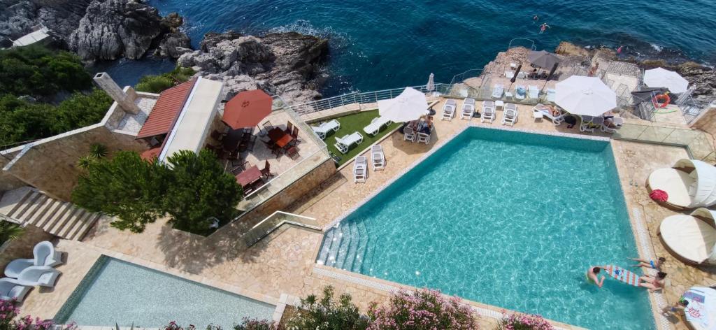 an overhead view of a swimming pool and the ocean at Your Home Montenegro in Dobra Voda