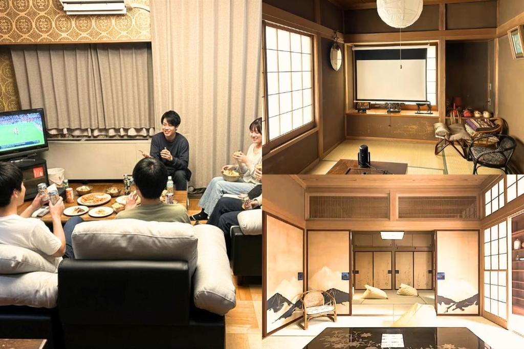 a group of people sitting in a living room watching a presentation at Jokan-en in Honjo