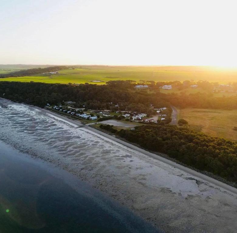 an aerial view of a beach and the ocean at BIG4 Wilsons Prom Holiday Park in Yanakie
