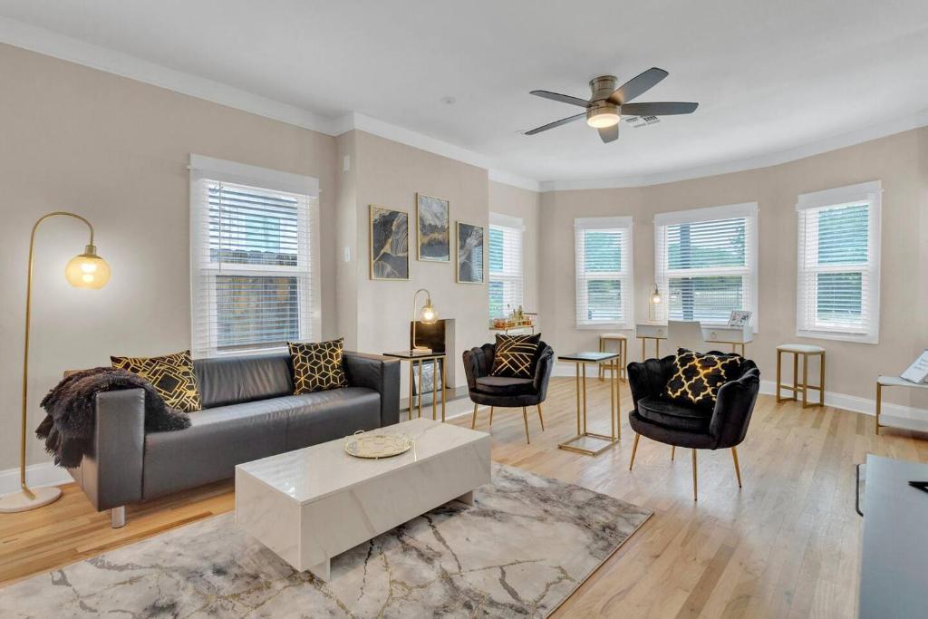 a living room with a couch and chairs and a table at The Marbled Speakeasy - San Antonio Luxury Home by the Alamo in San Antonio