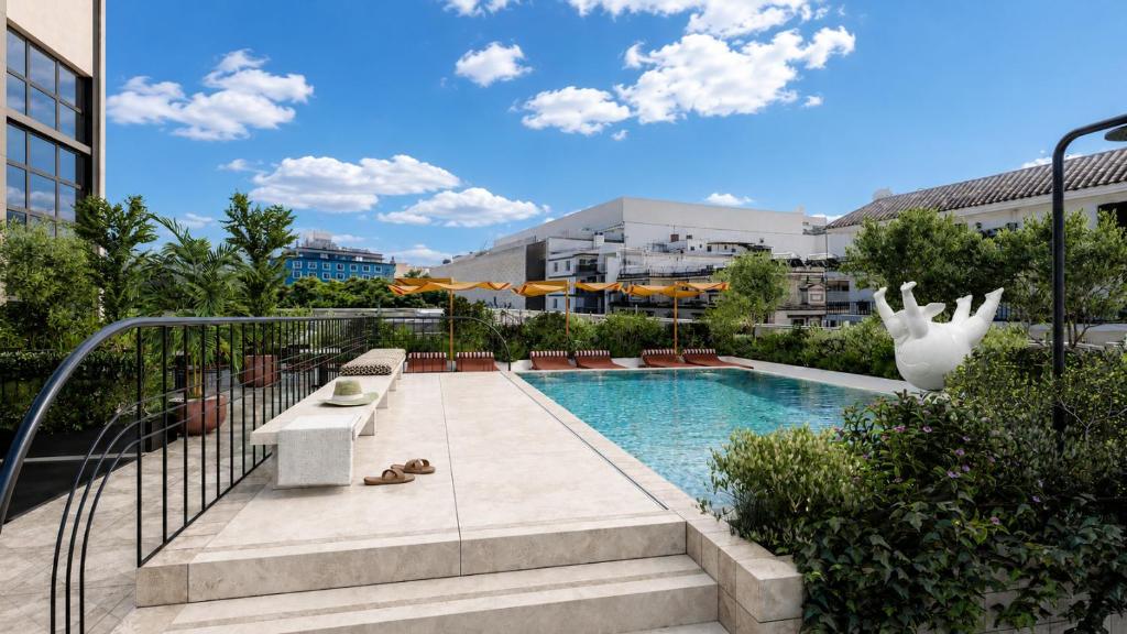 a swimming pool in the middle of a building at Thompson Seville, by Hyatt in Seville
