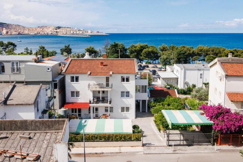 a view of a town with houses and the ocean at Apartments Stevo Nikočević in Bar
